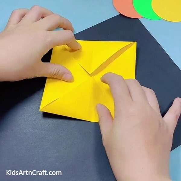 Making A Small Square- This guide for children will teach them how to produce a bulldozer with origami paper