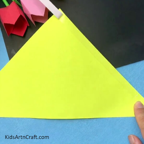 Applying Double-Sided Tape On The Sheet-Crafting a Cone-Formed Giraffe Ornament for Children 