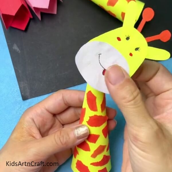 Pasting The Face To The Body-Fun giraffe paper decoration craft for the kids to make