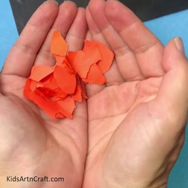 Tearing Out Orange Paper Pieces-Putting Together a Cone-Shaped Giraffe Trimming for Little Ones 