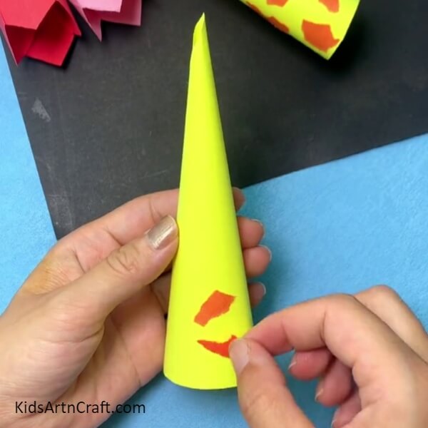Pasting The Pieces Over The Cone- Forming a Cone-Modeled Giraffe Decoration for Children 