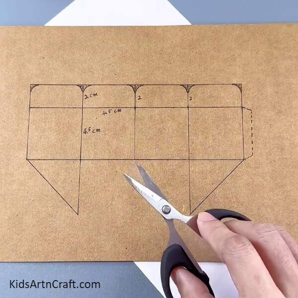 Cutting Out The Cardboard Box Figure- Learn how to make a flower pot from cardboard boxes - for kids