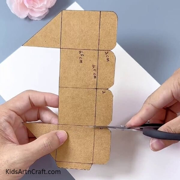Cutting The Curved Parts-A tutorial specifically for kids to make a flower pot out of cardboard boxes