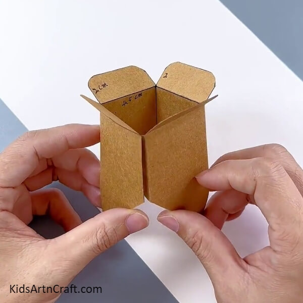 Enclosing And Making A Box- A craft tutorial to help children create a flower pot using cardboard boxes
