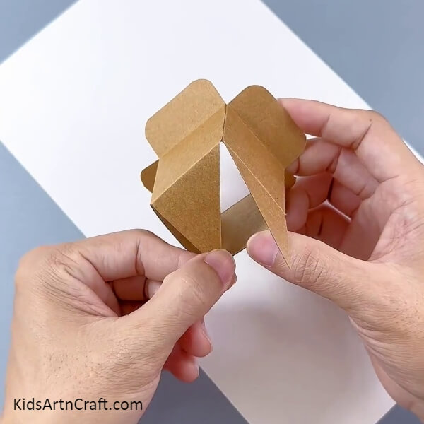 Turning The Box To The Bottom-Constructing a flower pot from cardboard boxes - a tutorial for children