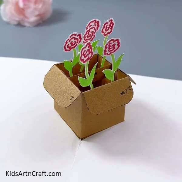 This Is The Final Look Of Your Cardboard Box Flower Pot Craft-Step-by-step instructions to turn a cardboard box into a flower pot, perfect for kids.