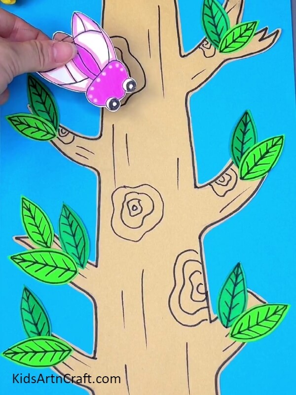Pasting The Pink Bug On The Tree- Learn to Craft Bugs on Trees with Paper in Just a Few Steps 