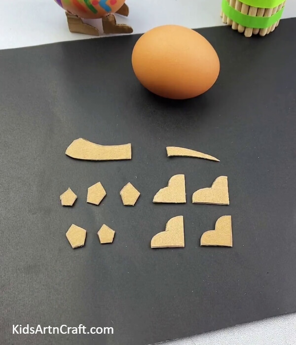 Cutting Out Dinosaur Parts- Creating a Dinosaur Model from Egg Shells and Cardboard