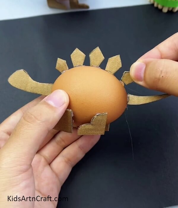 Pasting The Pentagon Scales- Making a Dinosaur Model Out of Egg Shells and Cardboard