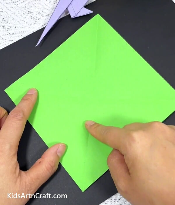 Making '+' Creases-Teaching kids how to create origami parrots
