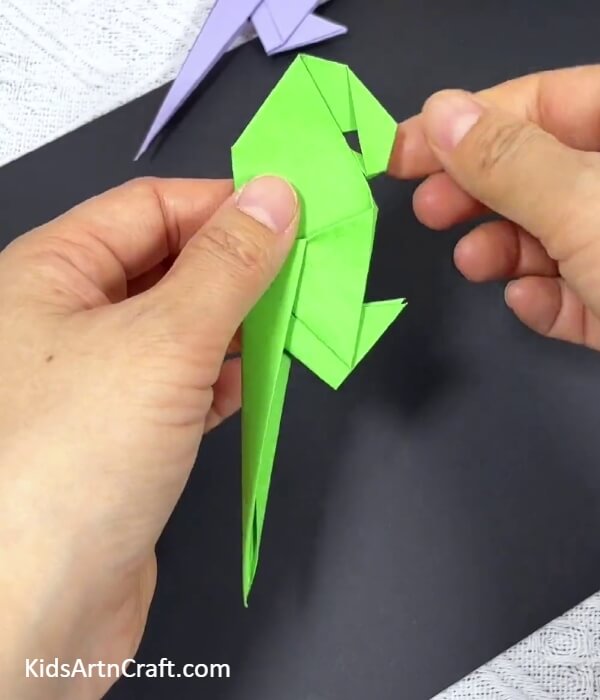 Shaping The Beak Of The Parrot-Crafting an origami parrot with kids as a project