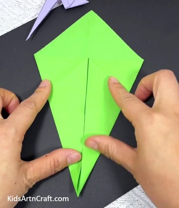 Making A Kite Shape-Crafting a parrot using origami for children