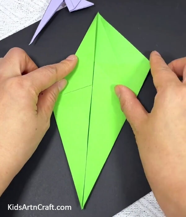 Folding The Upper Part Of The Kite Shape-Guide to making an origami parrot with kids