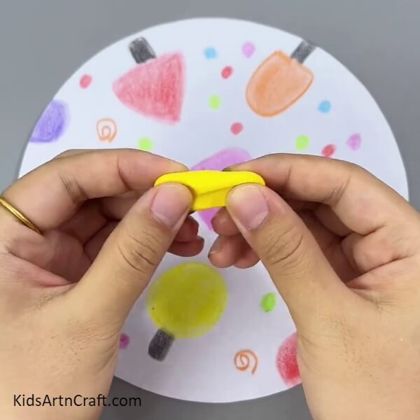 Taking Out A Piece Of Yellow Clay- Crafting Ice Cream Art during the Sunny Months