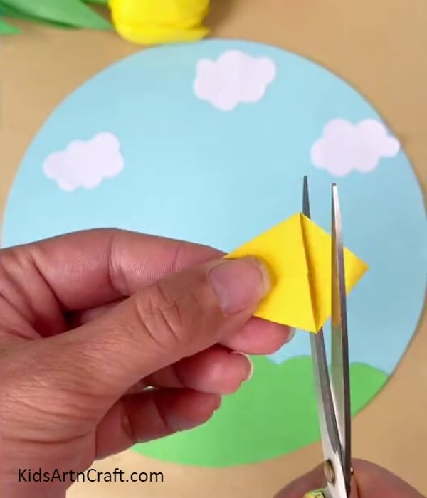 Cutting Out The Small Triangle From Kite- A guide to help kids create their own paper kite. 
