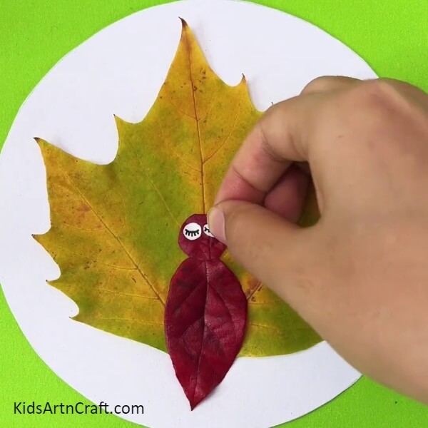 Pasting Eyes- How to Create a Leaf Turkey with Children - A Guide