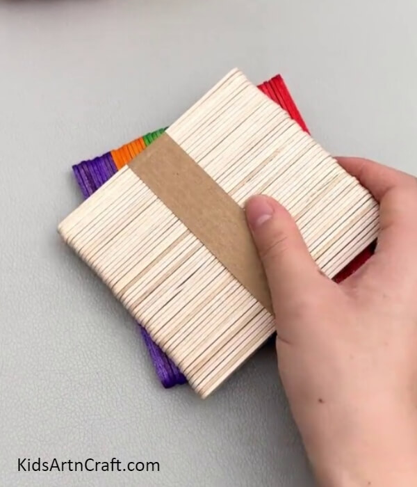 Taking Packs Of Popsicle Sticks- How to Make a Miniature House Out of Popsicle Sticks for Kids