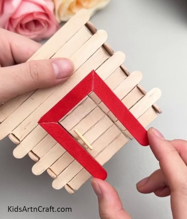 Making The Frame Of The Door- Step-by-step instructions on how to make a miniature home out of popsicle sticks for children
