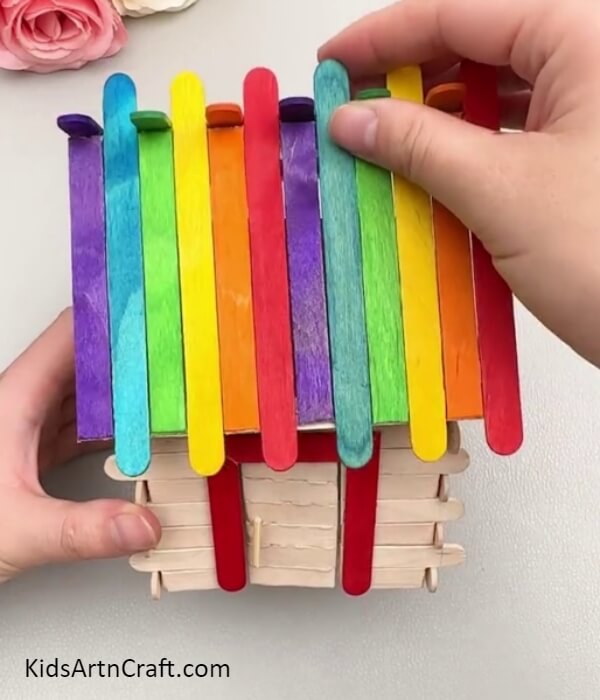 Sticking The Roof Over The Walls- Tutorial for making a small home out of popsicle sticks for young ones