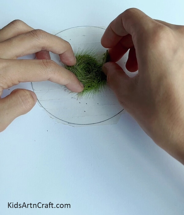 Making A Spiral Over The Tape In The Circle- Learn How to Make a Simple Octopus Utilizing Synthetic Turf Strips