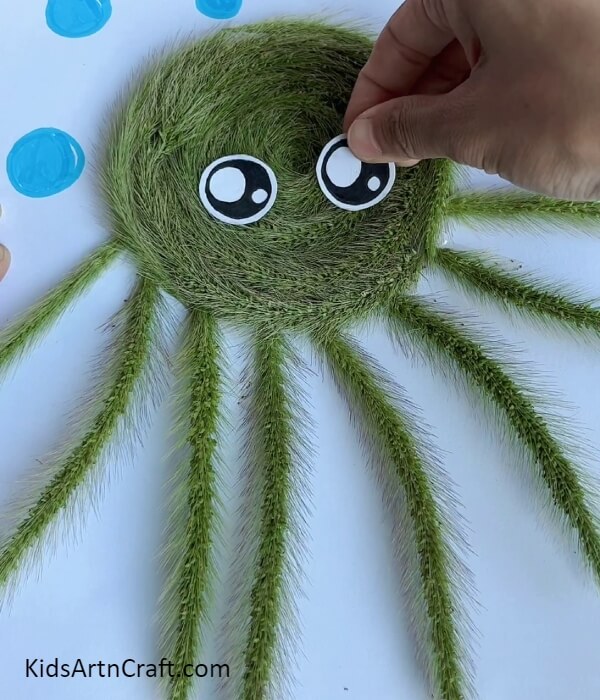 Pasting Eyes To The Octopus- Make an Octopus Quickly with Fake Grass Strands