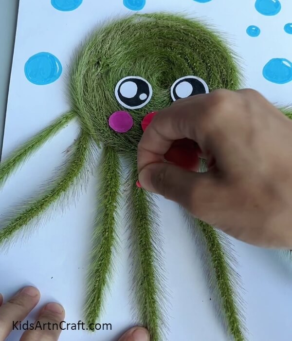 Making Mouth And Blush On The Octopus- Craft an Easy Octopus with Artificial Grass