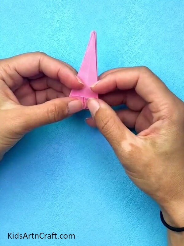 Folding The Corners To The Middle- A Tutorial on Crafting an Origami Ball Gown for Kids