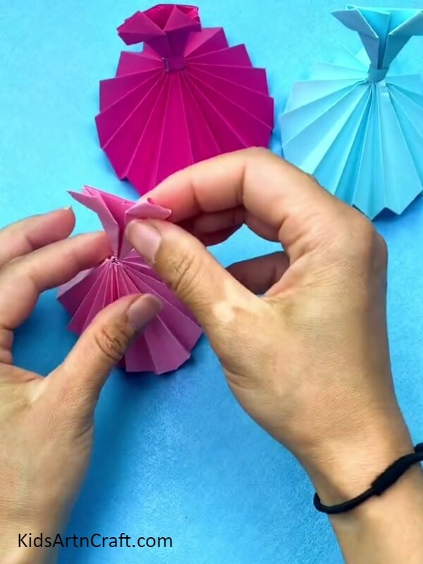 Placing The Top In The Ball Gown Skirt- Explaining the origami ball gown craft to kids