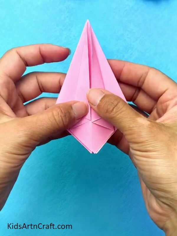 Folding The Sides Of The Kite Shape- Learn How to Craft an Origami Ball Gown for Kids
