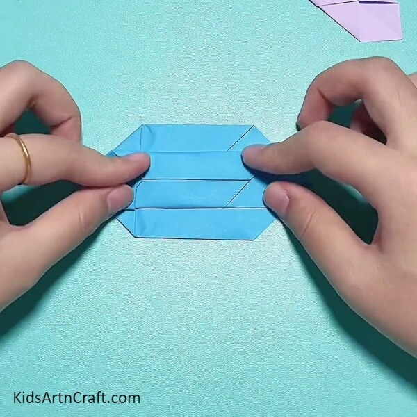 Folding The Diamond Sides To The Crease-Constructing a Peppa Pig Wristwatch Band from Origami