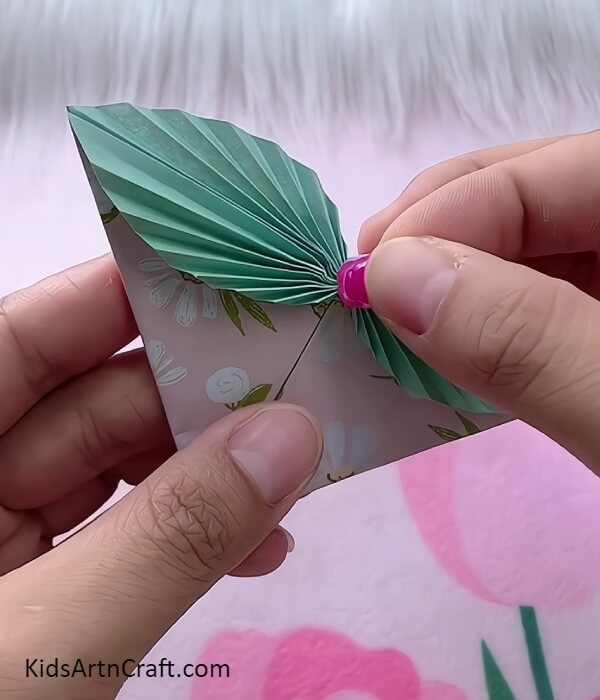 Pasting A Craft Rose Bead To Secure The Fold-Paper Crafts for Little Ones at the Edge of the Bookmark