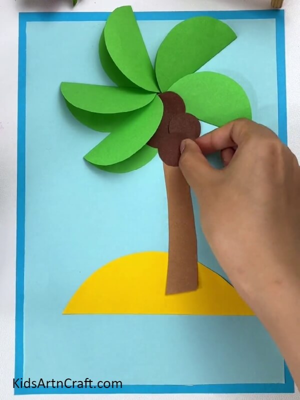 Pasting More Coconuts- Helping kids make a paper coconut tree. 