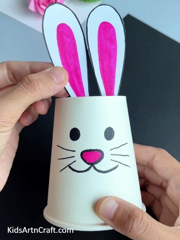 Pasting The Other Ear- An enjoyable activity for children is to construct a paper cup bunny and feed it a carrot.