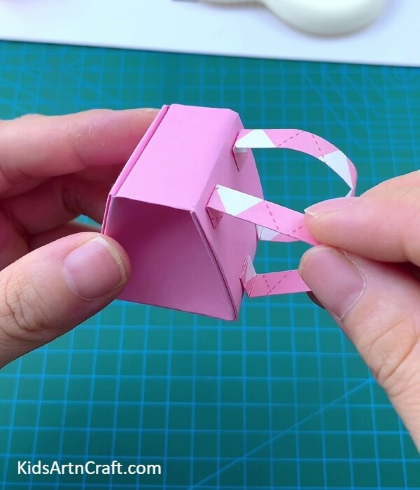 Attracting The Bag Straps- Building a Paper Origami Backpack For Little Ones