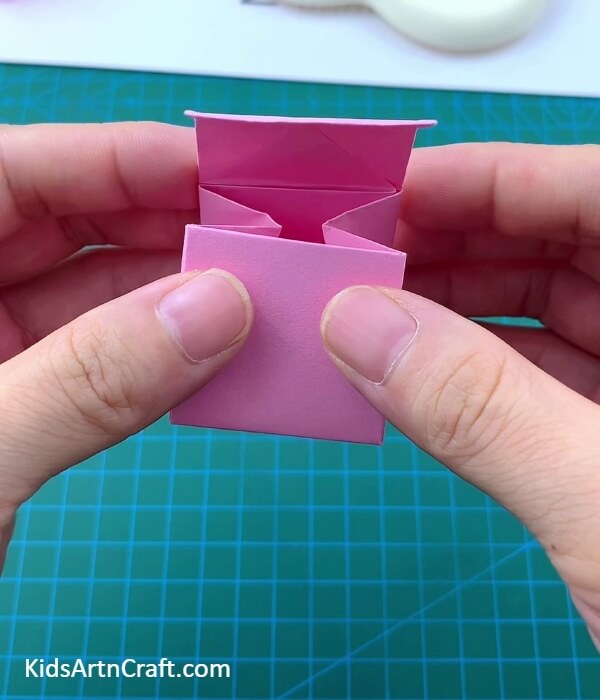 Giving The Shape Of A Bag- Constructing a Paper Origami Sack for Kids
