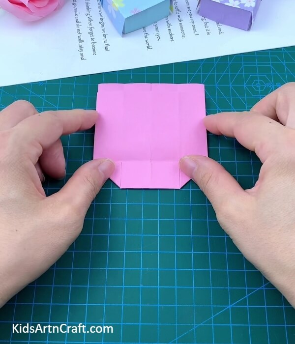 Making A Horizontal Crease Along Folded Corners- Paper Folding for Kids to Create a Bed and Pillow