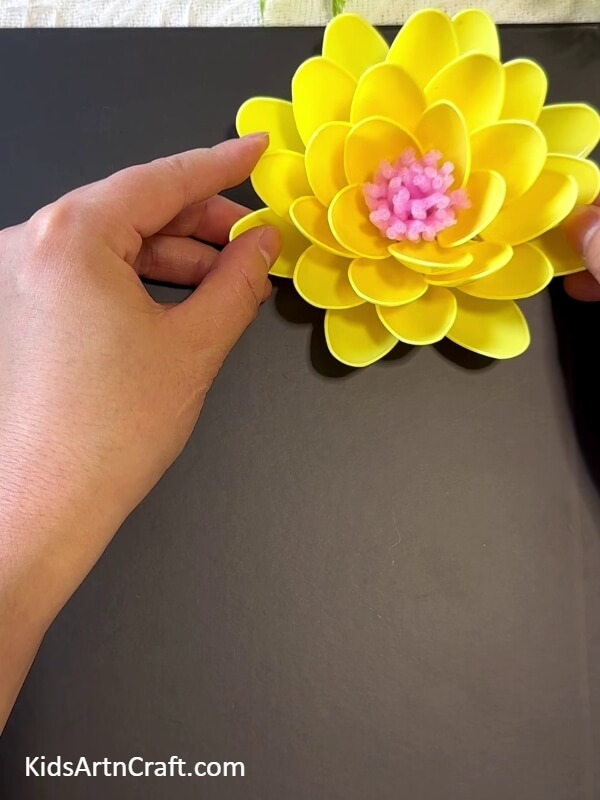Sticking The Flower On The Sheet- Kids' Sunflower Art Project with Plastic Spoons 