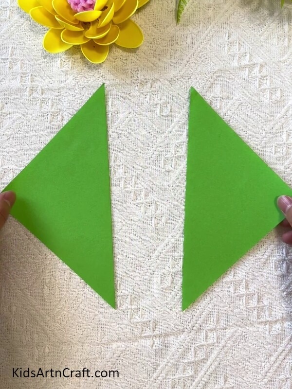 Cutting Out 2 Triangles- Sunflower Craft for Kids Utilizing Plastic Spoons 