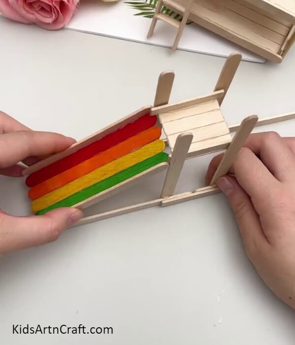 Sticking The Slanting Slab To The Base- Demonstration on How to Construct a Sliding Model Using Popsicle Sticks for Children
