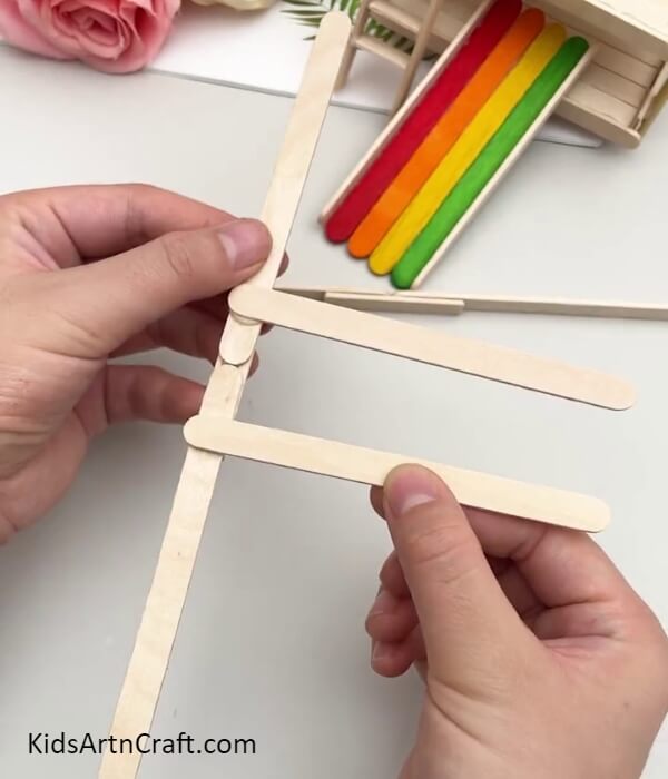 Pasting 2 Popsicle Sticks Over The Base- Teach Kids How to Make a Moving Structure with Popsicle Sticks