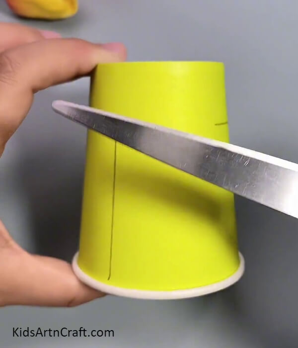 Taking Scissors To Cut-Tutorial for kids to construct a fan utilizing recycled paper cups