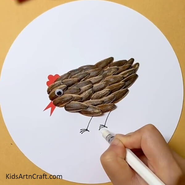 Drawing Legs Of The Hen- Creating Art with Sunflower Seeds, Peanut Shells, and Hen & Chicks Tutorial