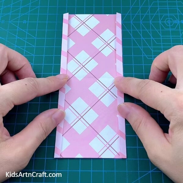 Folding The Sides Of A Rectangular Paper-A Guide for Children to Create their Own Origami Polybag with Paper