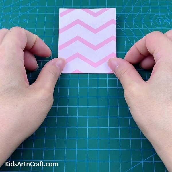 Folding Along The Horizontal Crease-Step-by-Step Directions for Kids to Make an Origami Polybag with Paper