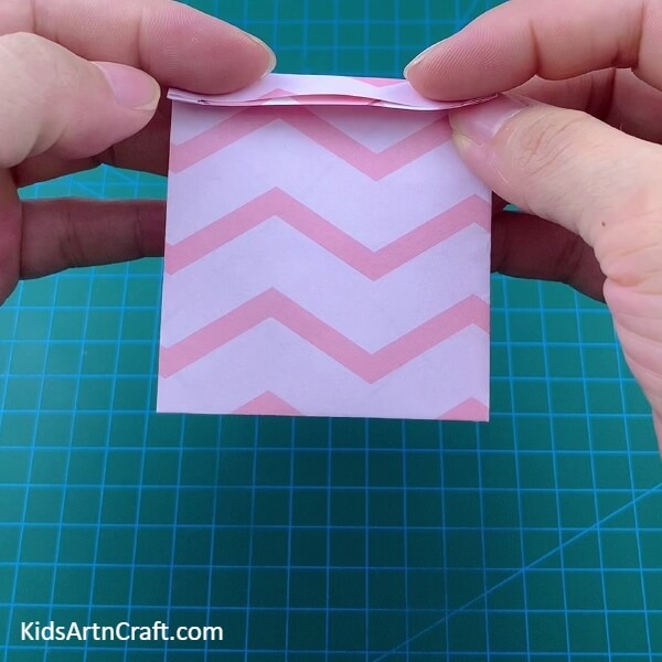 Folding The Opened Side-How to Teach Children to Construct an Origami Polybag with Paper