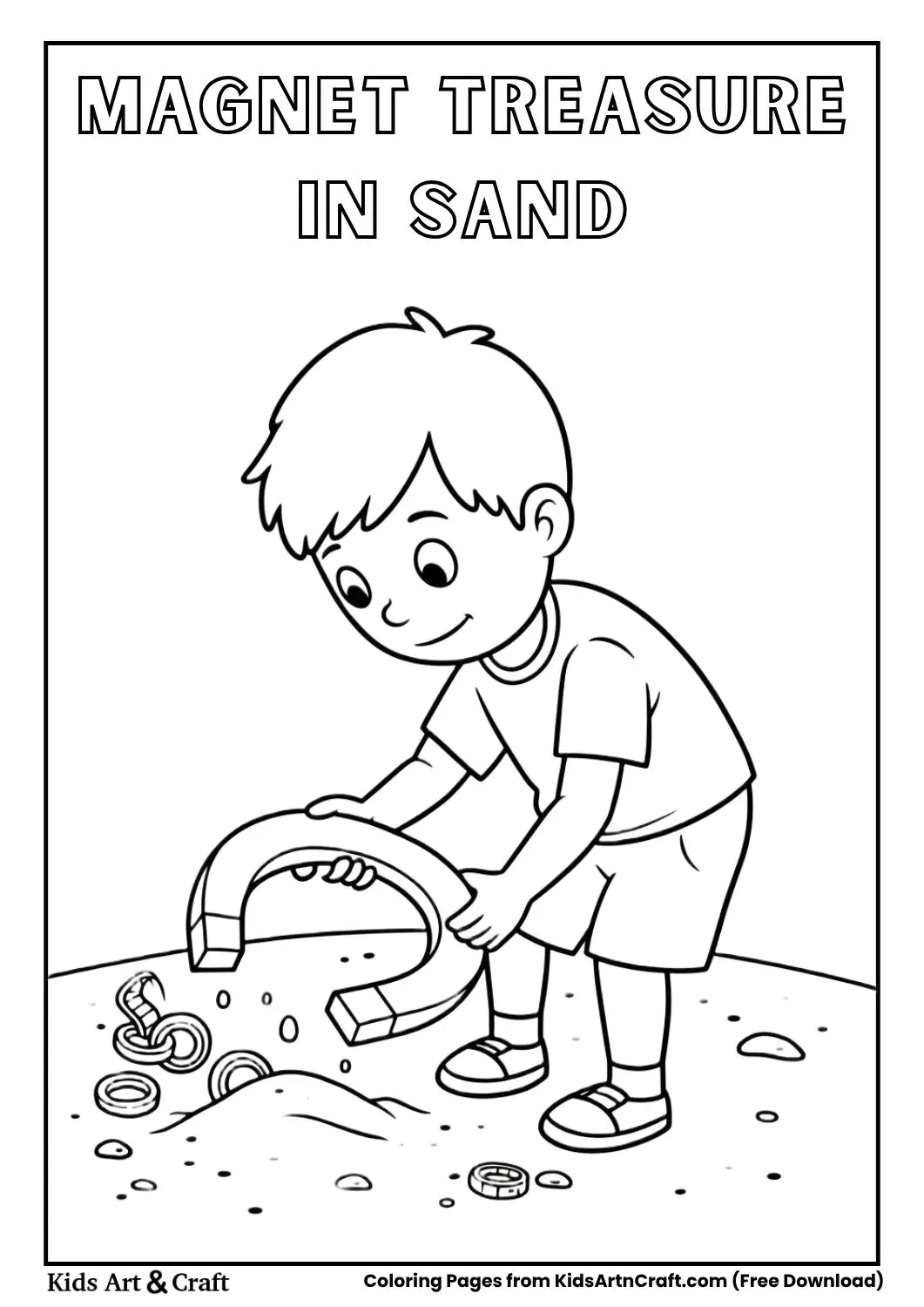 Boy using magnet in sand to find metal