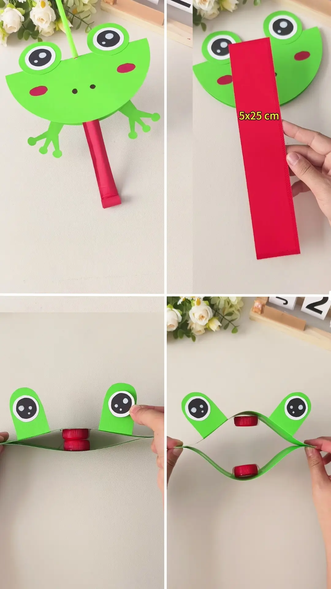 Green frog paper craft made with folded paper, googly-style eyes, and a red paper tongue.